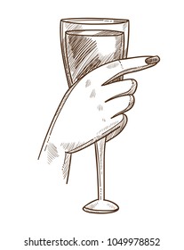 Glass of exquisite wine in tender female hand