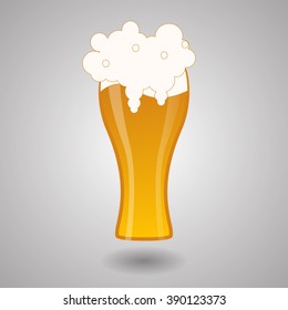 Glass filled of golden light beer with overflowing froth heads.