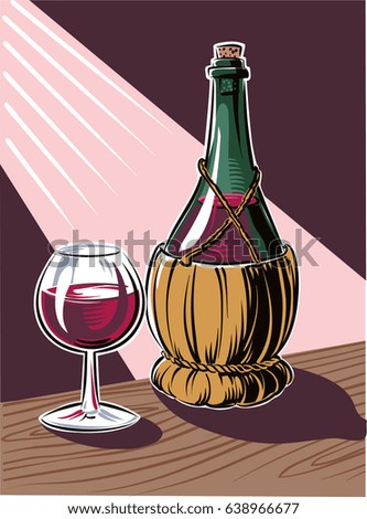 Glass filled with red wine, just poured from a flask.