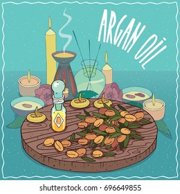 Glass Flacon of Argan oil and fruits of Argania spinosa plant. Fragrances essential oil in diffuser. Natural vegetable oil used for aromatherapy. Vector illustration