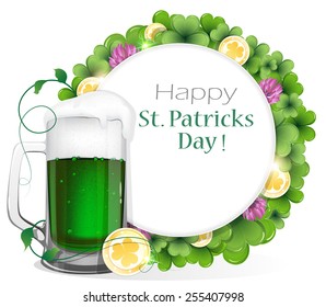 Glass of green beer and gold coins on clover background with round place for text.   St. Patrick's Day background.