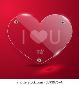 Glass heart on a red background. Plate. Valentine's Day. The glass plate with the fixings