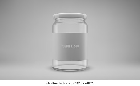 Glass jam jar with a lid. A transparent jar with a white lid and label.