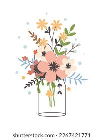 Glass jar with a bouquet of spring flowers. Cute simple vintage style.