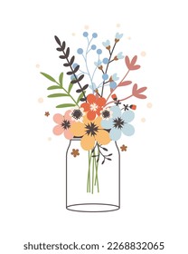 Glass jar with a bouquet of spring flowers. Cute simple vintage style.