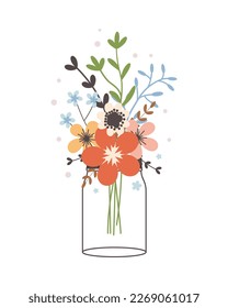 Glass jar with a bouquet of spring flowers. Cute simple vintage style.