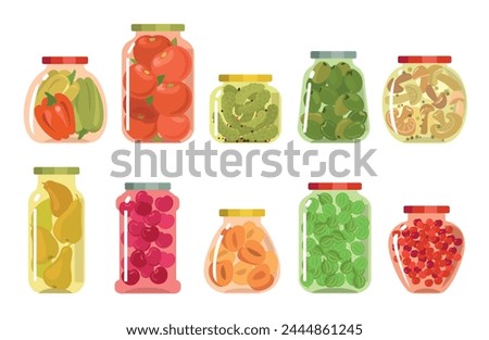 Glass jars with preserved vegetables. Compotes and pickles. Winter food preparation. Homemade sweet berry jams. Marinated cucumbers or tomatoes. Kitchen containers