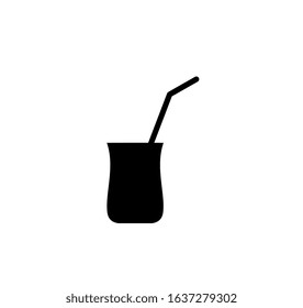 a glass of juice with straw