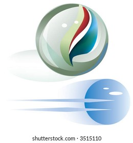 glass marbles, one in motion