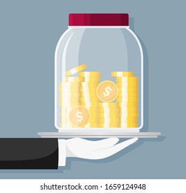 	
Glass money jar full of gold coins and hand. Saving dollar coin in moneybox. Growth, income, savings, investment. Symbol of wealth. Business success. 