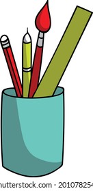 glass with office supplies, pens, brushes in a stand