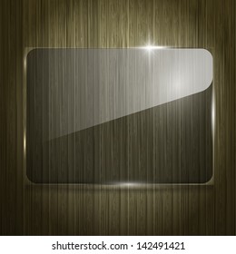 Glass panel on the wooden background. Texture of glass and wood.