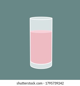 Glass of pink lemonade on a green background