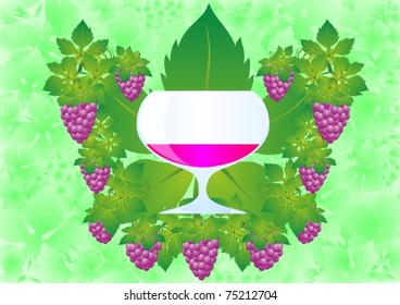 A glass of red wine on the background of the fruits and leaves of the grape