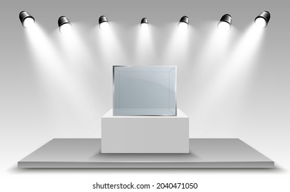 Glass showcase for the exhibition in the form of a cube. Background for sale illuminated by spotlights. Museum glass box isolated advertising or business design boutique. Exhibition hall.	
