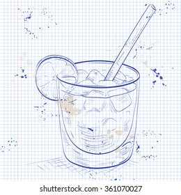 Glass of spritz aperitif aperol cocktail with orange slices and ice cubes on a notebook page