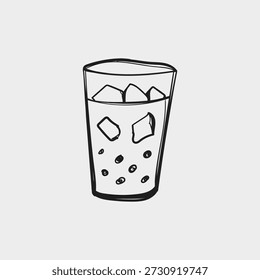 Un vaso se encuentra sobre una superficie plana llena de cubitos de hielo y burbujas oscuras. Esta sencilla bebida se muestra en un vaso transparente a una hora casual del día, dando una sensación de refresco.