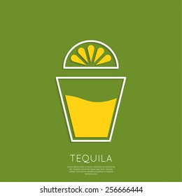 Glass of tequila with lemon.