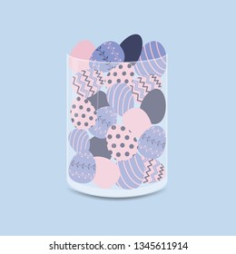 The glass vase is full of Easter eggs.