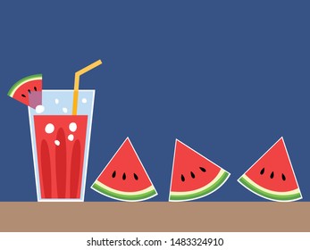 a glass of watermelon juice with three piece of watermelon on dark blue background. 