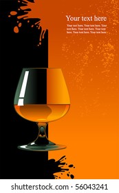 Glass of whiskey on orange and black background.