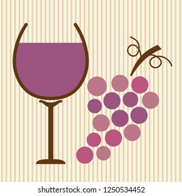 Glass of wine with different color of purple grapes