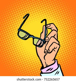 glasses in hand, vision and people. Comic book cartoon pop art retro vector illustration drawing