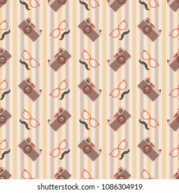 Glasses, Mustache, and Camera Striped Seamless Pattern - Fun glasses, mustaches, and cameras on vertical stripes background in cream, yellow, orange, and brown colors for Father's Day or hipster theme
