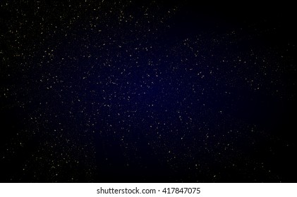Glitter dust on a black background. Gold glitter texture. Gold space.