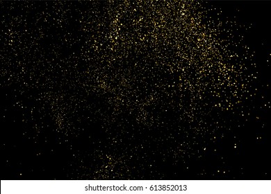 Glitter gold sparkle with particle dust confetti on abstract black background. Golden shine shimmer texture with spray splash scattered for celebration luxury elegant design