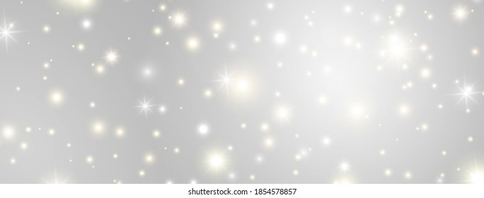 Glitter lights effect long banner. Magic dust particles. Christmas design. Bright golden and white sparkles on grey background. Shining stars composition. Sun flash. Vector illustration.