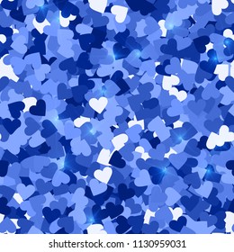 Glitter seamless texture. Actual blue particles. Endless pattern made of sparkling hearts. Immaculate abstract vector illustration.