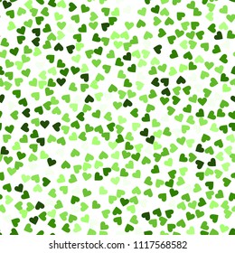 Glitter seamless texture. Actual green particles. Endless pattern made of sparkling hearts. Mesmeric abstract vector illustration.