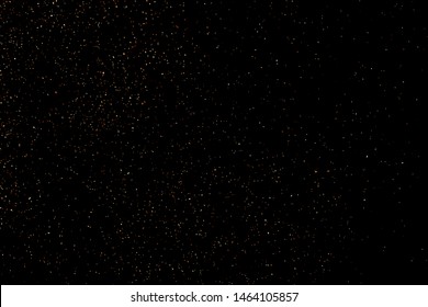 Glitter sparkle texture background with coffee brown gold golden dust particle on black. Shimmer shine abstract pattern scattered dot grain powder. Elegant luxury decorative overlay effect vector