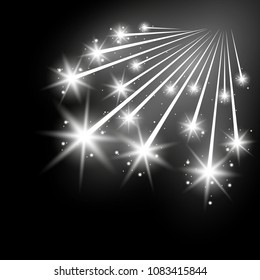 Glittering falling stars, glowing comet on black background, light effect, white color