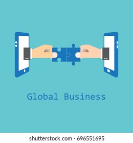 Global business and communication technology concept. Hands putting jigsaws together via smartphone.