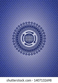 globalization icon inside emblem with denim texture