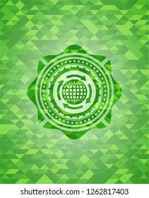 globalization icon inside green emblem with triangle mosaic background