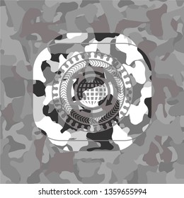 globalization icon inside grey camouflaged emblem