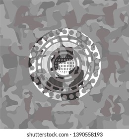globalization icon inside grey camouflaged emblem