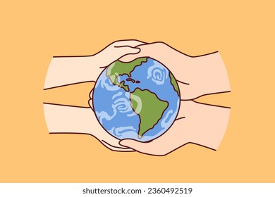 Globe in hands of two people caring about planet earth and wishing to save nature from pollution and climate change. Miniature globe to advertise environmental initiatives to reduce co2 emissions