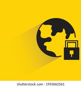 globe and key with shadow on yellow background