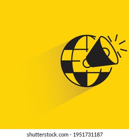 globe and megaphone with shadow on yellow background