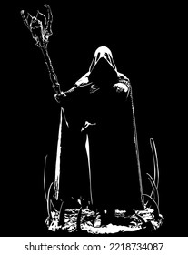 gloomy man in hood holding staff