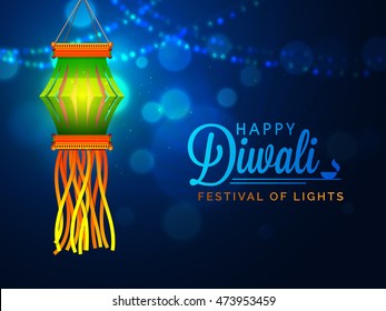 Glossy Diwali Lamp (Kandil) hanging on shiny blue night background for Indian Festival of Lights Celebration.