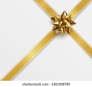 Glossy gold bow. Glowing bow with crossing golden ribbons isolated on white. Festive decorative element for design. Holiday gift decoration. Greeting card template. Realistic vector illustration