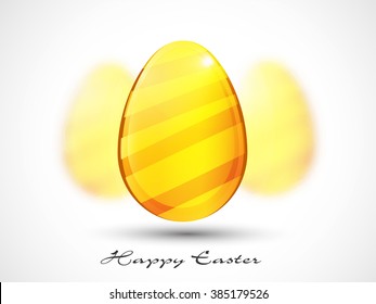 Glossy Golden Egg on grey background for Happy Easter celebration.