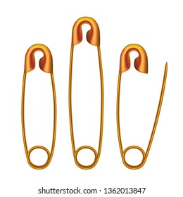 Glossy golden safety pins isolated on white