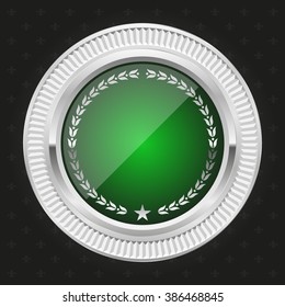 Glossy green badge with silver border on black background