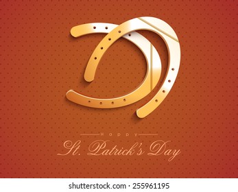 Glossy horseshoes on brown background for Happy St. Patrick's Day celebration.